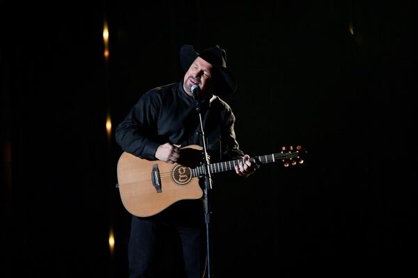 Garth Brooks performed at the CMA Awards, but also called for a moment of silence to honor the 12 victims of the California bar shooting.