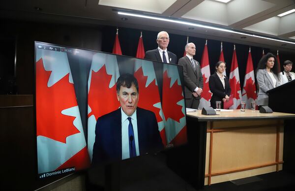 Canada Minister of Public Safety, Democratic Institutions and Intergovernmental Affairs Dominic LeBlanc speaks virtually at a press conference on new measures to strengthen gun control in Ottawa, Ontario, on Thursday, Dec. 5, 2024. (Patrick Doyle/The Canadian Press via AP)