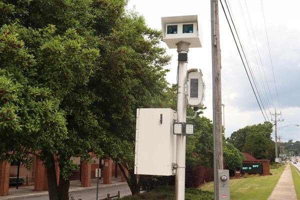 A speed camera on U.S. Highway 78 next to South Gwinnett High School in Snellville. The cameras capture video footage and the license plate of people driving 11 mph or higher over the posted speed limit an hour before and after and while class is in session. (Tyler Wilkins / tyler.wilkins@ajc.com)