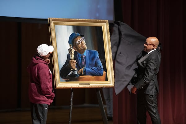 President David A. Thomas reveals Spike Lee’s portrait to him during Morehouse’s inaugural Human Rights Film Festival on Oct. 12, 2019. It will be installed in the Martin Luther King Jr. International Chapel. CONTRIBUTED BY SEAN MCNEIL