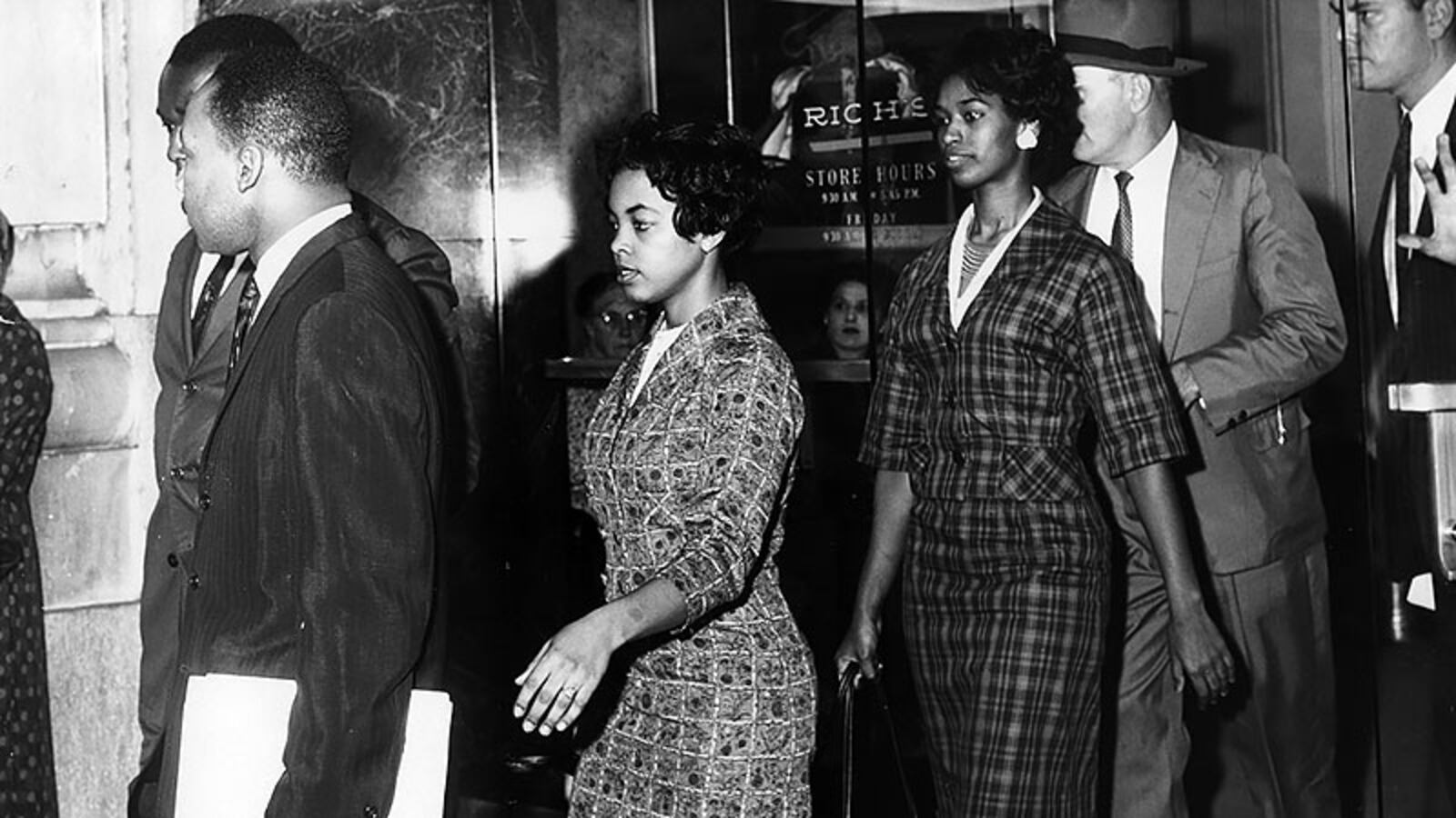 Martin Luther King (left front) and Lonnie King are arrested at Rich’s in Atlanta, Ga. on Oct. 19, 1960.