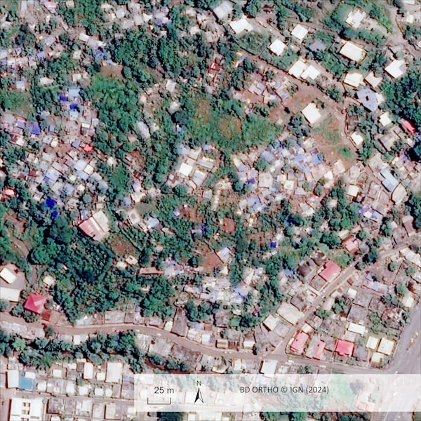 This undated satellite photo provided on Wednesday Dec. 18, 2024 by the Institut Geographique National (IGN) shows Doujani in the Indian Ocean French territory of Mayotte, before the cyclone Chido. (IGN via AP)