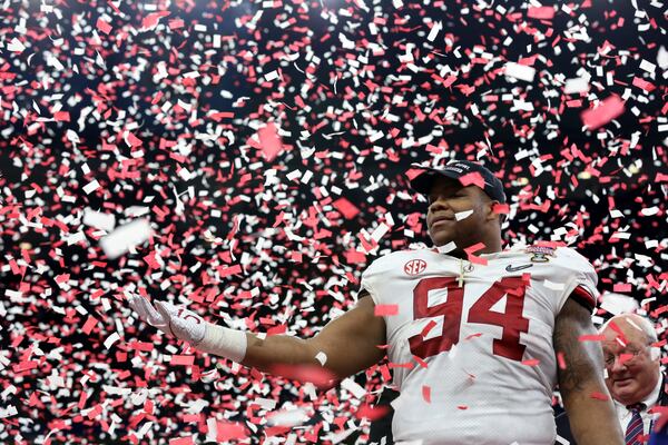 The defensive star of the Sugar Bowl, Alabama defensive lineman Da'Ron Payne, bathes in the confetti of victory late Monday night in New Orleans. (AP Photo/Rusty Costanza)