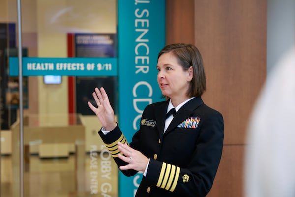 Captain Lisa Delaney stands in front of the entrance of  “The Health Effects of 9/11” exhibit at at David J. Sencer CDC Museum on Thursday, September 7, 2023. Delaney leads the Emergency Preparedness and Response at CDC/National Institute for for Occupational Safety and Health. (Natrice Miller/ Natrice.miller@ajc.com)