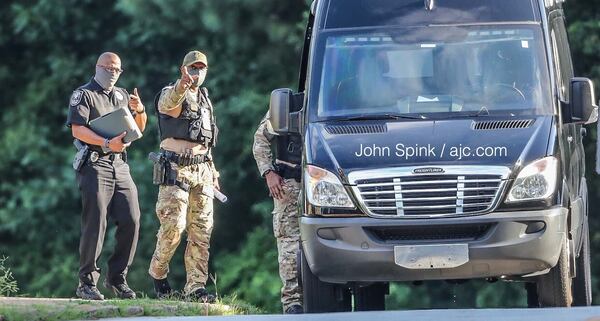 Police were called to a neighborhood near Knollberry Lane after they said a woman shot a man and barricaded herself inside a home.