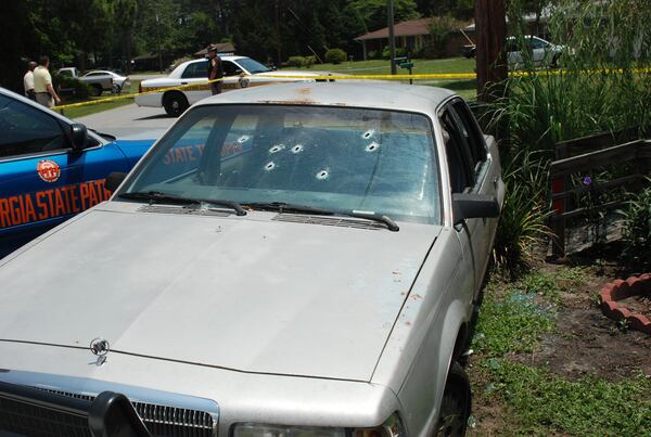  Officers fired eight bullets through Caroline Small's windshield. Her car was hemmed in by several police cars and a utility pole.