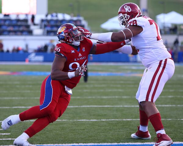 LAWRENCE, KS - NOVEMBER 18: Kansas Jayhawks defensive tackle Daniel Wise (96) rushes against Oklahoma Sooners offensive lineman Orlando Brown (78) in the second quarter of a Big 12 game between the Oklahoma Sooners and Kansas Jayhawks on November 18, 2017 at Memorial Stadium in Lawrence, KS. (Photo by Scott Winters/Icon Sportswire via Getty Images)