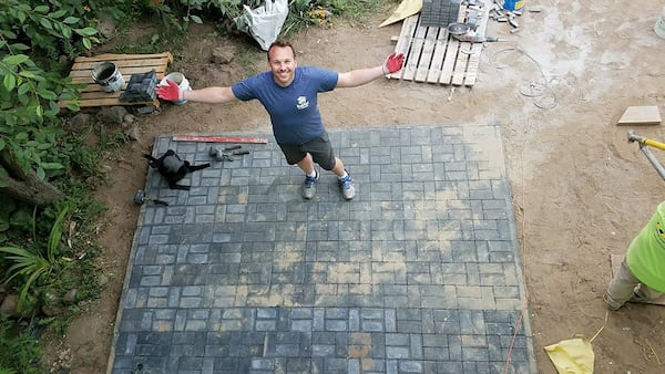 Daniel Jahn, a senior financial analyst with General Motors in Detroit, stands on top of a patio that he helped build in Redzynskie, Poland, for a needy family. This was Jahn’s fifth Habitat for Humanity trip in four years. He travels with his sister, Margaret Wilkoff, and her husband, Jake, both of whom live in Chicago and ventured to Poland as part of our journey. “This is perfect,” Jahn said. “Instead of just seeing the sights, you’re also immersing yourself in different cultures. How often do you get to work side by side with someone from a different country?” CONTRIBUTED BY MARGARET WILKOFF