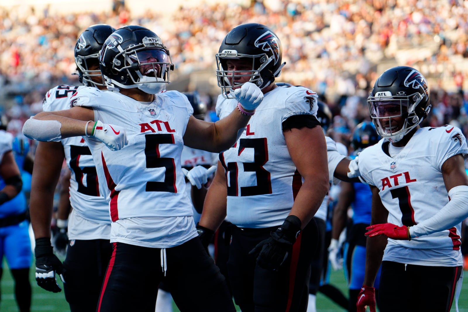 Atlanta Falcons wide receiver Drake London (5) celebrates a touchdown in the first half of an NFL football game against the Carolina Panthers in Charlotte, N.C., Sunday, Oct. 13, 2024. (AP Photo/Jacob Kupferman)