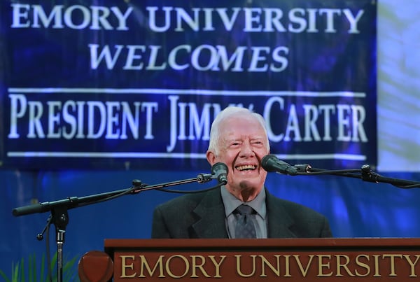 Former President Jimmy Carter takes the podium to answer questions from students during his annual town hall with Emory University freshmen in the campus gym on Sept. 12, 2018, in Atlanta. Curtis Compton/AJC