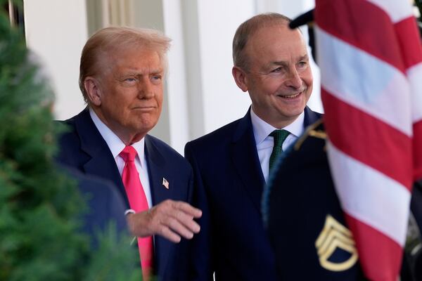 President Donald Trump greets Ireland's Prime Minister Michael Martin as he arrives at the West Wing of the White House in Washington, Wednesday, March 12, 2025. (AP Photo/Alex Brandon)