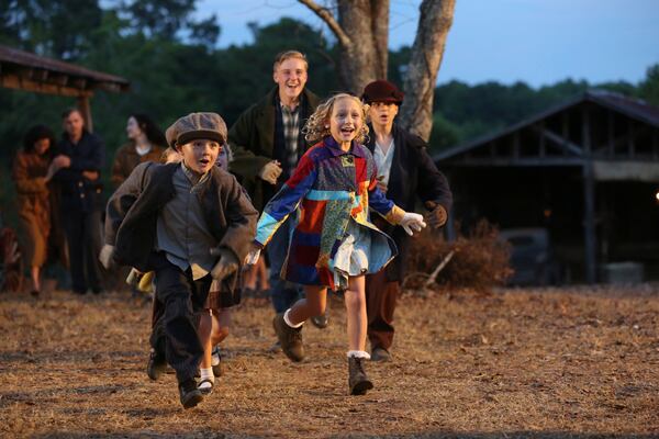 DOLLY PARTON'S CHRISTMAS OF MANY COLORS: CIRCLE OF LOVE -- Pictured: (l-r) Blane Crockarell as Bobby Parton, Alyvia Alyn Lind as Dolly Parton, Parker Sack as David Parton, Dylan Michael Rowen as Denver Parton -- (Photo by: Quantrell Colbert/NBC)