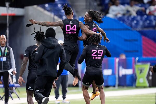 Kentucky defensive back Max Hairston (10) celebrates after running the 40-yard dash at the NFL football scouting combine in Indianapolis, Friday, Jan. 28, 2025. (AP Photo/George Walker IV)