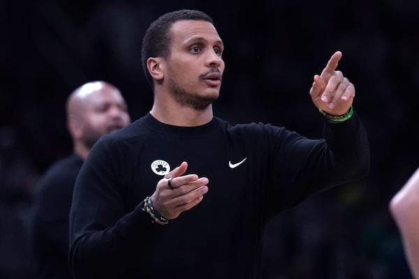 Boston Celtics head coach Joe Mazzulla calls to his players during the first half of an NBA basketball game against the Detroit Pistons, Wednesday, Dec. 4, 2024, in Boston. (AP Photo/Charles Krupa)