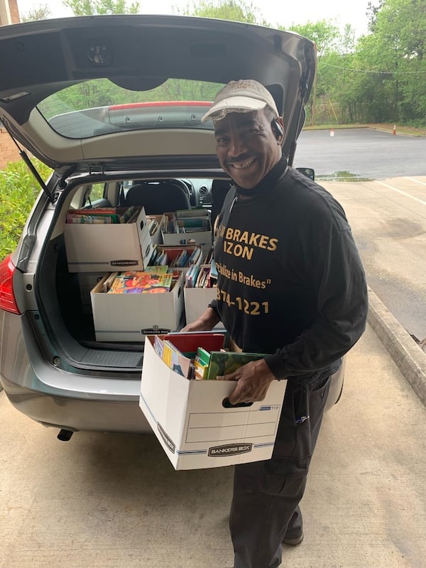 An employee at the Books For Africa warehouse in Marietta loads boxes of books for HOPE volunteers. Photo courtesy of North River HOPE Worldwide