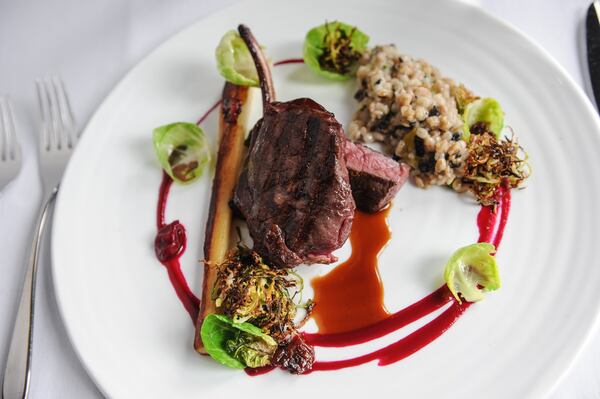 150305-ATLANTA-GA- John Kessler's restaurant review of Atlas, inside the Buckhead St. Regis, on Thursday March 5, 2015. FOOD: Pecan- grilled cervena venison chop- roasted parsnip Marrow Bone, Charred Brussels Sprouts, Barley Porridge, Plum- Cherry Puree. (www.Beckysteinphotography.com) Venison chop at Atlas 9all photos by Becky Stein)