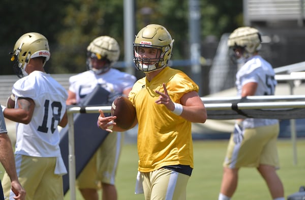 August 4, 2017 Atlanta - Georgia Tech Yellow Jackets quarterback Matthew Jordan (11) smiles as he runs through a drill during the first day of Georgia Tech football practice at Rose Bowl Field in Georgia Tech campus on Friday, August 4, 2017. HYOSUB SHIN / HSHIN@AJC.COM