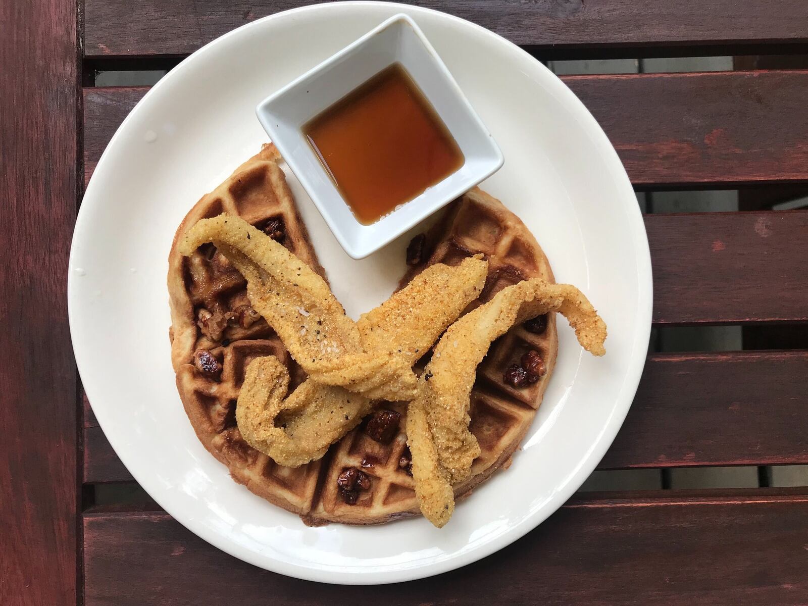 Catfish and Waffles is one of many catfish preparations at Catfish Hox. LIGAYA FIGUERAS / LIGAYA.FIGUERAS@AJC.COM