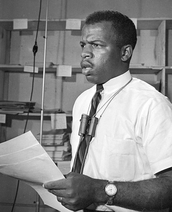 John Lewis, chairman of the Student Nonviolent Coordinating Committee, speaks at a news conference in Jackson, Miss., June 23, 1964. He called on President Johnson to protect summer volunteers in Mississippi and said that civil rights workers face harrassment, arrests and outright violence in the state. (AP Photo/Jim Bourdier)