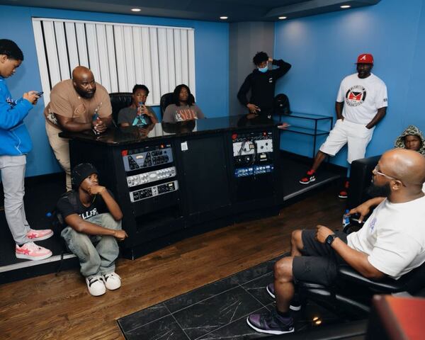 Teens from hip-hop star Quavo's Rocket Camp under his nonprofit, The Rocket Foundation, participate in a music education workshop with engineer Jay Fooley Beatz (right seated) at Quality Control Studio in Atlanta on Monday, July 22, 2024.