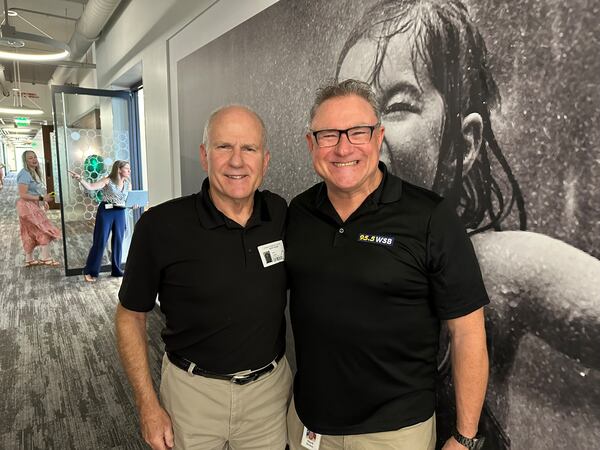 Scott Slade, recently retired WSB radio morning host, came up with the Care-a-thon idea 24 years ago. He is here with veteran traffic reporter "Smilin'" Mike McKay at the Care-a-thon July 26, 2024. RODNEY HO/rho@ajc.com