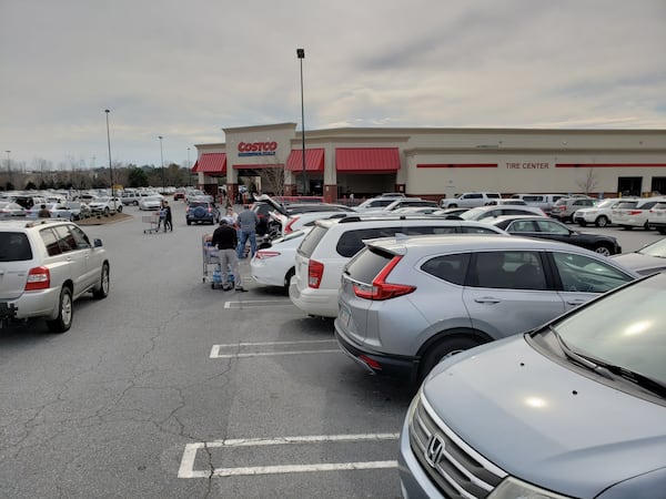 Concerns about the new coronavirus and increasing cases in the United States pushed some metro Atlanta shoppers to stock up on food, water and other supplies in recent days, including at a Costco in Buford in Gwinnett County. (MATT KEMPNER / AJC)