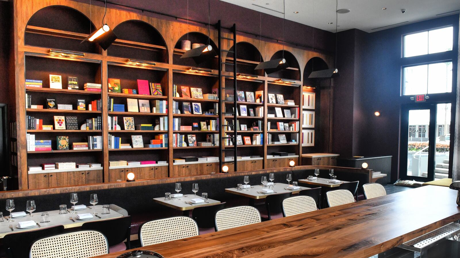 “It’s been really wonderful to see how many people come in for food and wine, and then after looking at the bookshelves during their meal, they end up on that side, and take home books,” said Lucian Books and Wine co-owner Katie Barringer, who was the founder of Cover Books. (Chris Hunt for The Atlanta Journal-Constitution)