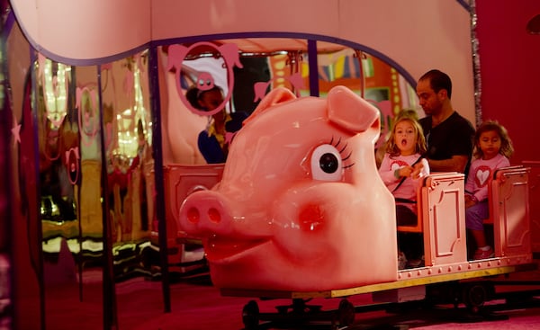 The Macy’s Pink Pig at Lenox Square mall in Buckhead (shown in November 2013) is a family favorite. Priscilla the Pink Pig carried children of all ages through a life-size storybook filled with friends and fun. JONATHAN PHILLIPS / SPECIAL