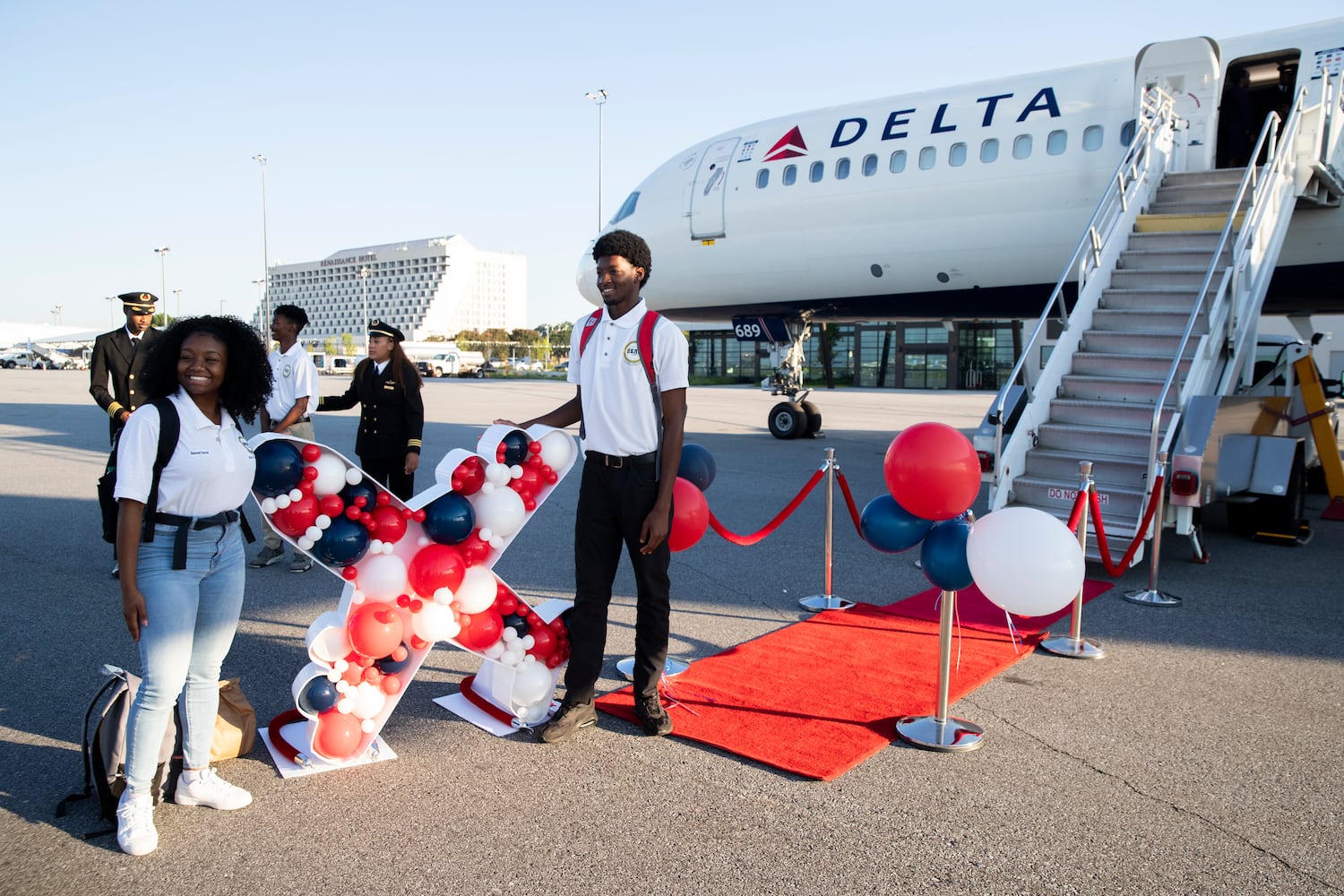 Participants of Delta’s Dream Flight 2022 event pose for a photo before boarding a plane at Hartsfield-Jackson Atlanta International Airport on Friday, July 15, 2022. Around 150 students ranging from 13 to 18 years old will fly from Atlanta to the Duluth Air National Guard Base in Duluth, Minnesota. (Chris Day/Christopher.Day@ajc.com)