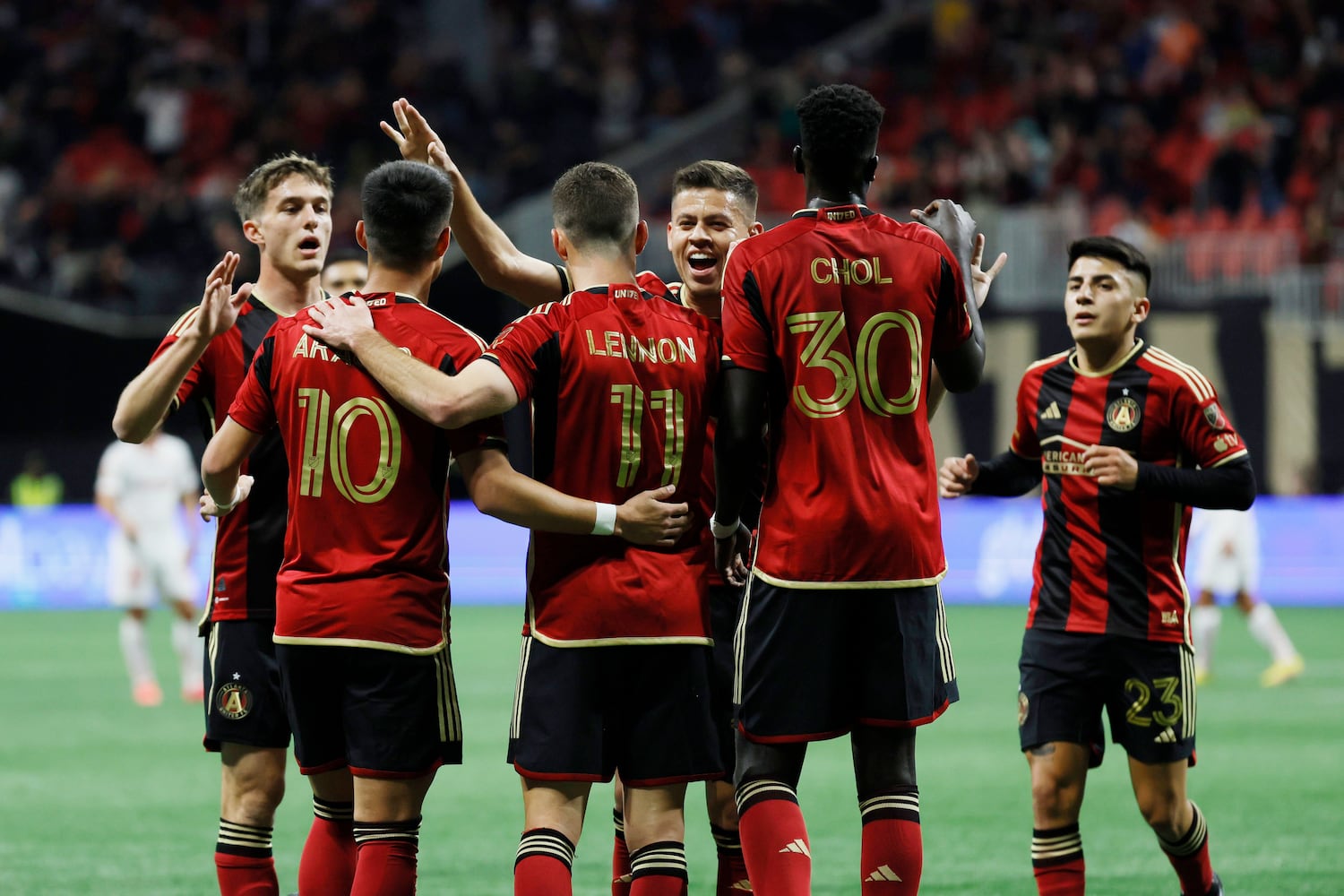 Atlanta United players celebrate as they surround defender Brooks Lennon after he scored a goal during the first half against Liga MX Toluca of an exhibition match on Wednesday, Feb 15, 2023, in Atlanta.
 Miguel Martinez / miguel.martinezjimenez@ajc.com