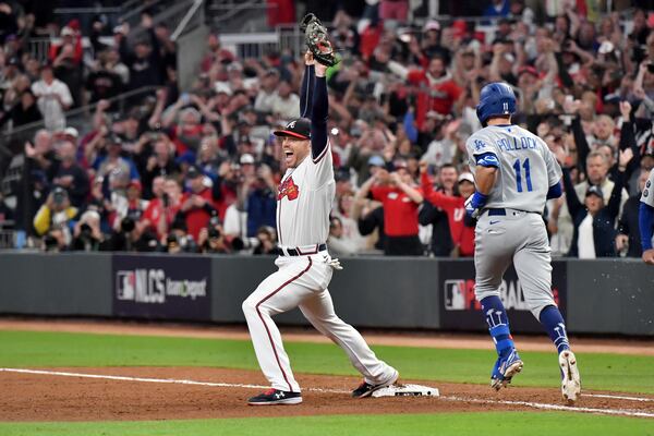 Braves first baseman Freddie Freeman reacts after retiring Dodgers left fielder AJ Pollock for the final out in the Braves' 4-2 win in Game 6 of the National League Championship Series. (Hyosub Shin / Hyosub.Shin@ajc.com)