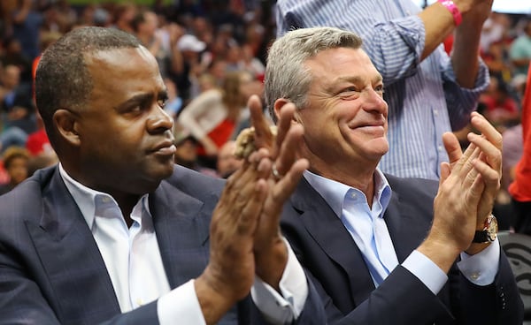 Atlanta Hawks lead owner Tony Ressler and Atlanta Mayor Kasim Reed applaude the Hawks during a playoff game in April. Curtis Compton/ccompton@ajc.com