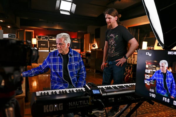 (Left to right) Rick Beato and his studio assistant Billy Jones play back footage while editing a new episode for Beato’s Youtube channel on Thursday, November 10, 2022. (Natrice Miller/natrice.miller@ajc.com)  