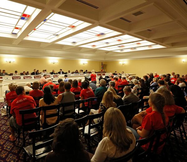 This photo taken Monday, Aug. 18, 2014 shows hearings on legislation to repeal Common Core academic standards in the House Finance Hearing Room at Ohio Statehouse in Columbus, Ohio. Millions of students will sit down at computers this year to take new tests rooted in the Common Core standards for math and reading, but policymakers in many states are having buyers remorse. The fight to repeal the standards has heated up in Ohio, where Republican legislators such as state Rep. Andy Thompson saying its kind of creepy the way this whole thing landed in Ohio with all the things prepackaged. (AP Photo/Columbus Dispatch, Kyle Robertson)