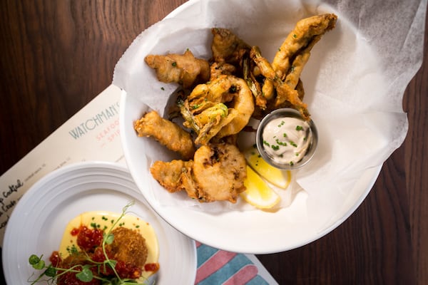 Crispy Baby Herring with green onion, black garlic aioli, malt, and lemon.