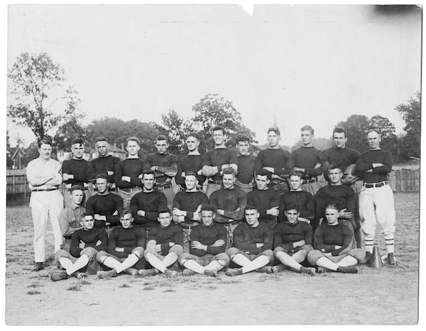 A team photo of the 1918 Georgia Tech football team, which was the defending national champion. Four members of the team, including coach John Heisman (far right third row) are in the College Football Hall of Fame. The others are Bill Fincher (third row, next to Heisman), Joe Guyon (third row, two from Fincher) and Buck Flowers (second row, far right) (Georgia Tech Archives)