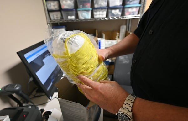 A box of respirator masks are among the items that AmeriPro EMS purchased from a local store. (Hyosub Shin / Hyosub.Shin@ajc.com)