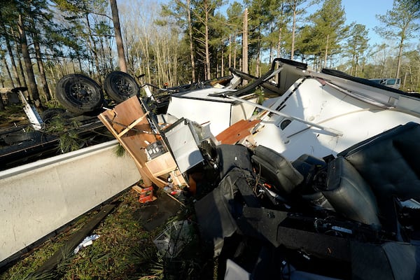 Furniture and kitchen appliances are exposed in the remnants of a recreational vehicle damaged by a series of storms that passed the region at Paradise Ranch RV Resort in Tylertown, Miss., Sunday, March 16, 2025. (AP Photo/Rogelio V. Solis)