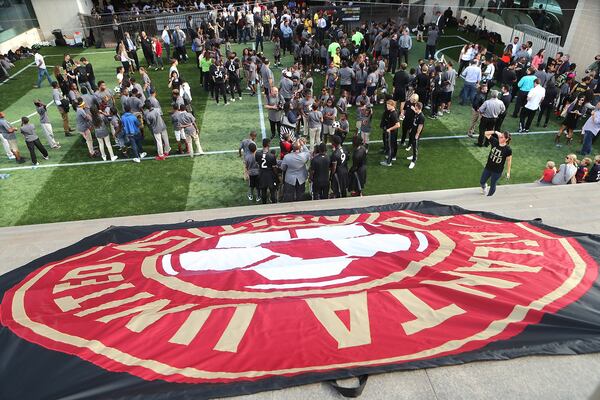 Participants cover the field during the opening of the 9,600-square foot mini-pitch at the Five Points MARTA station on Thursday. Curtis Compton /ccompton@ajc.com