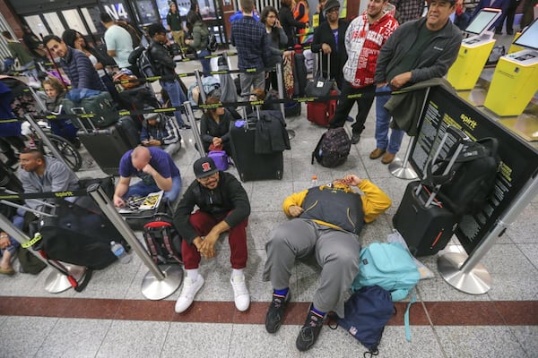 December 16, 2017 Hartsfield-Jackson International Airport: The ticket counters were swamped with travelers on Monday Dec. 18, 2017 at Hartsfield-Jackson International Airport the day after a massive power outage brought operations to halt. Power was restored at the world’s busiest airport after a massive outage Sunday afternoon that left planes and passengers stranded for hours, forced airlines to cancel more than 1,100 flights and created a logistical nightmare during the already-busy holiday travel season. Frustration remained high Monday at Hartsfield-Jackson International Airport as passengers tried to figure out if they could get to their next destinations. As of 7 a.m. Monday, 405 flights have been canceled. UPS and FedEx say the fire that knocked out power and shut down the world’s busiest airport won’t delay holiday package deliveries. JOHN SPINK/JSPINK@AJC.COM