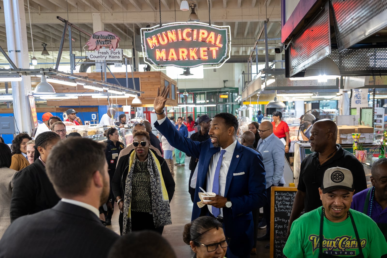 Atlanta Mayor Andre Dickens (center) tours the Municipal Market in Atlanta on Friday, October 18, 2024. (Arvin Temkar / AJC)