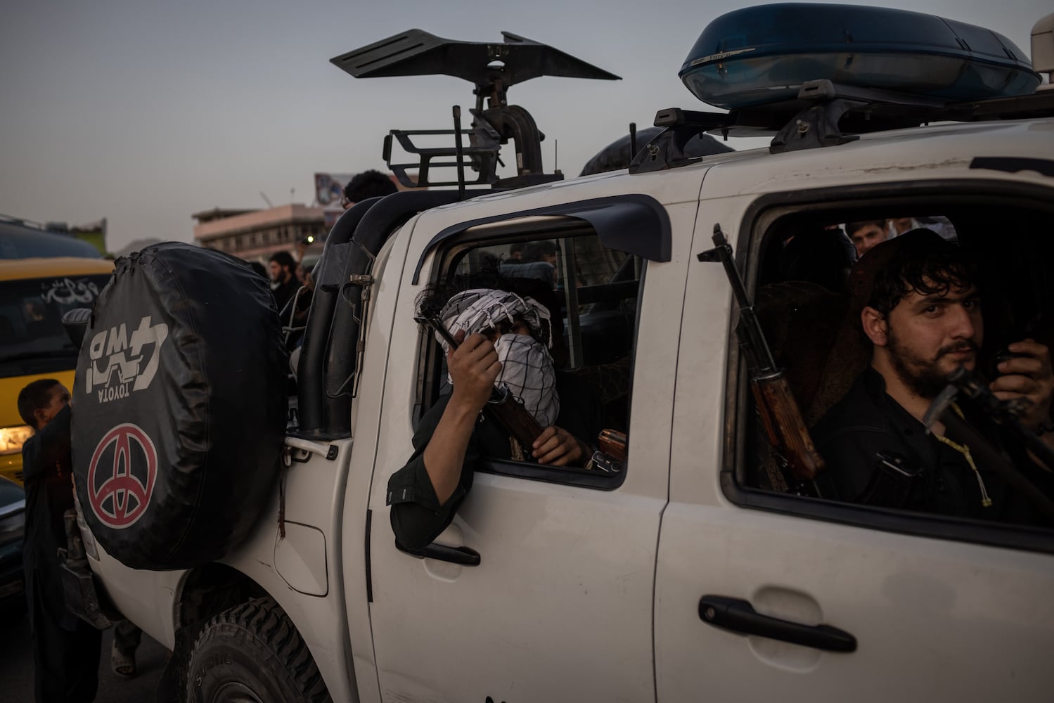 Taliban fighters drive into Kabul, Afghanistan, Aug. 15, 2021. (Jim Huylebroek/The New York Times)