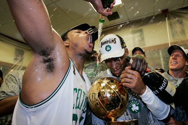 FILE - Boston Celtics' Paul Pierce, left, and Ray Allen celebrate in the locker room after winning Game 6 of the NBA Finals over the Los Angeles Lakers to win the championship Tuesday, June 17, 2008, in Boston. (AP Photo/Winslow Townson, File)