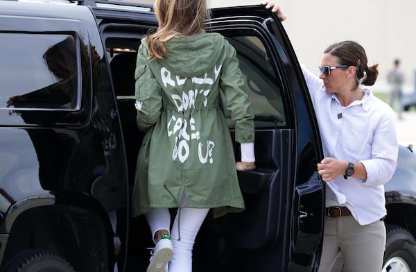 Melania Trump climbs back into her motorcade after traveling to Texas to visit facilities that house and care for children taken from their parents at the U.S.-Mexico border June 21, 2018 at Joint Base Andrews, Maryland. Trump was criticized for wearing this jacket that reads, "I really don't care, do u?" on the back.