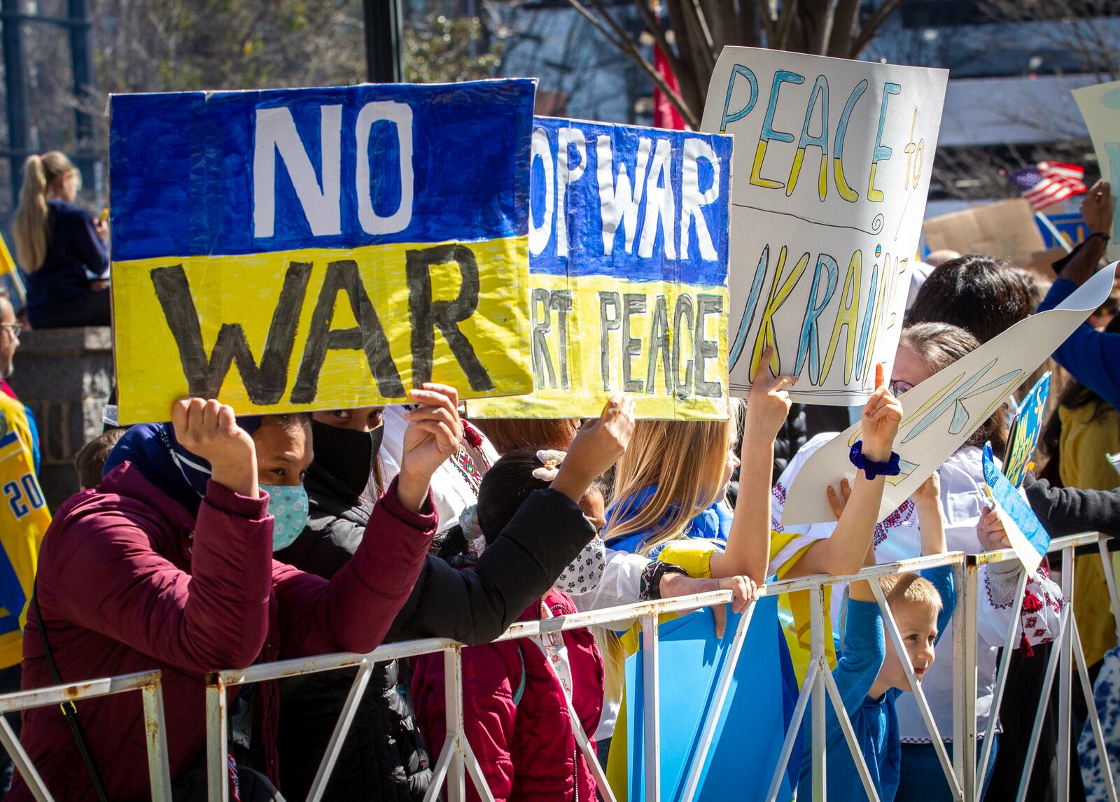 People show their support for Ukraine during a rally outside Centennial Olympic Park on Saturday, February 26, 2022.  STEVE SCHAEFER FOR THE ATLANTA JOURNAL-CONSTITUTION