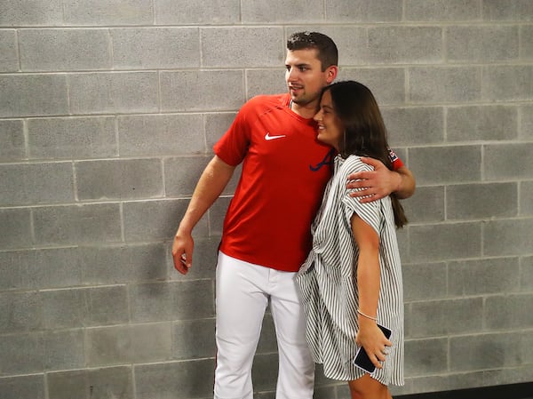 Braves third baseman Austin Riley gets a hug from his wife Anna after his press conference.   “Curtis Compton / Curtis Compton@ajc.com