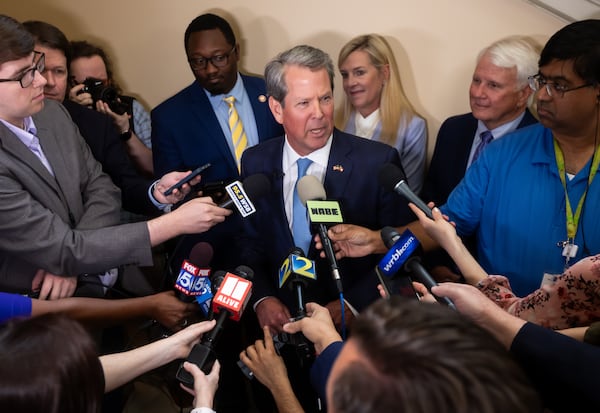 Gov. Brian Kemp answers questions from the media on Tuesday, May 7, 2024 after he signed a $36.1 billion budget for fiscal 2025, which begins July 1. As the annual Capitol bill-signing season wound down Tuesday, Gov. Brian Kemp inked a $36.1 billion state spending plan for the coming fiscal year that includes raises for 300,000 educators and state workers, plus more money for law enforcement, education and mental health programs. The raises are included in the budget for fiscal 2025 — which begins July 1 and was approved by lawmakers on the final day of the 2024 legislative session in March. Kemp signed the spending plan at the Capitol in front of about 50 lawmakers and state agency heads, telling those in attendance, “This yearly budget is the biggest demonstration of our priorities and the biggest tool we have to serve the people of this great state.” State tax collections have been slow for the past year. But the state is sitting on $16 billion in “rainy day” and undesignated reserves, so Kemp and lawmakers have backed higher spending since the session began in January. (John Spink/AJC)