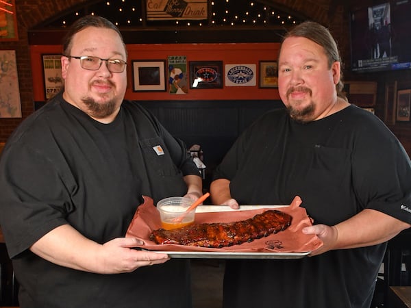 Justin (left) and Jonathan Fox of Fox Bros. Bar-B-Q show off their Brookhaven Rib Glaze.