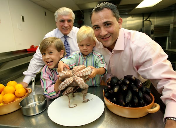 Family is always at the heart of Buckhead Life Restaurant Group. Pano Karatassos (from left) gathers with his son Pano I. Karatassos and grandsons Pano Alexander Karatassos and Lucas Karatassos at Kyma in 2006. AJC file