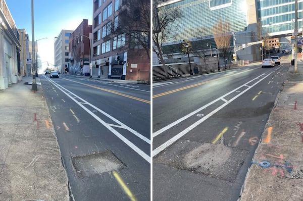 Potholes in a newly paved bike lane on Forsyth Street between Mitchell Street and M.L.K. Drive. (Michael Scaturro/AJC)